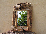 Imposant miroir orn de cornes de daim et de bois poli